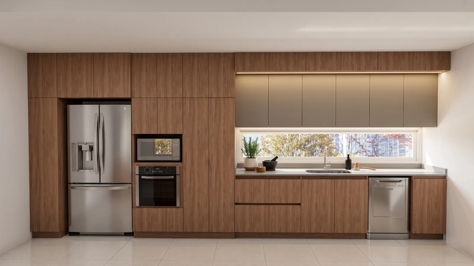 Vista frontal de cocina lineal en nogal con altos grises iluminados y electrodomésticos de acero